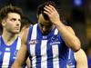 Robbie Tarrant of the Kangaroos (centre) looks dejected after the Round 17 AFL match between the North Melbourne Kangaroos and the Sydney Swans at Etihad Stadium in Melbourne, Sunday, July 15, 2018. (AAP Image/Hamish Blair) NO ARCHIVING, EDITORIAL USE ONLY