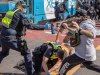 A police officer is kicked. World Wide Rally For Freedom protest September 18, 2021. Protesters meet a huge police presence in Richmond, blocking off the CBD with a ring of steel. Picture: Jason Edwards