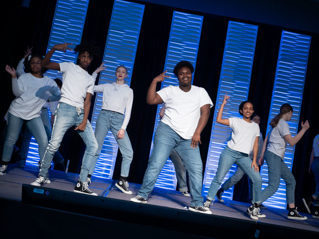 A dance group performs at a conference