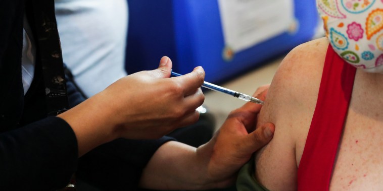 A person receives a dose of the Pfizer Covid-19 vaccination in Mexico City on May 11, 2021.