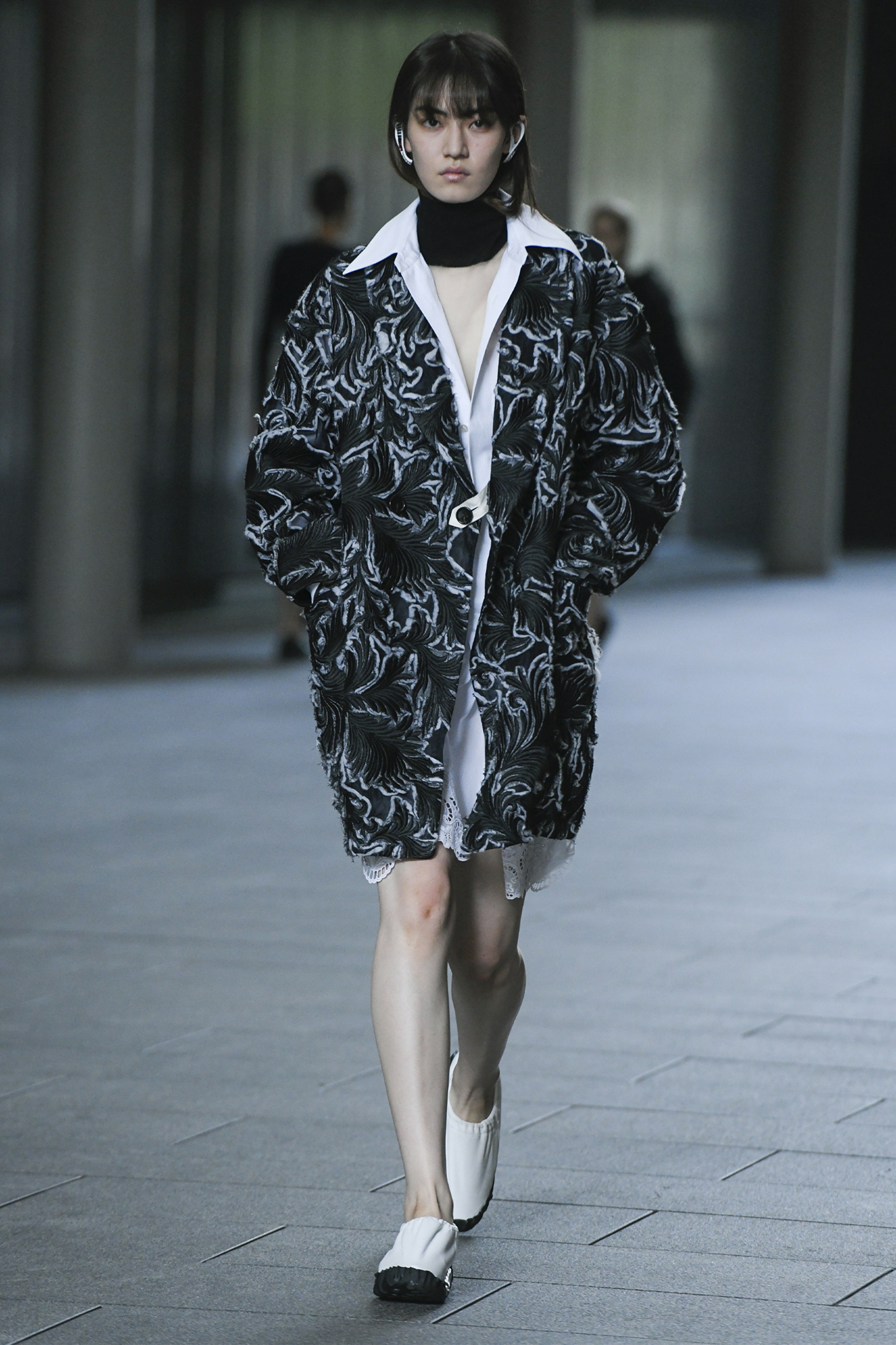 Image may contain Clothing Apparel Sleeve Human Person Long Sleeve Runway Coat and Fashion