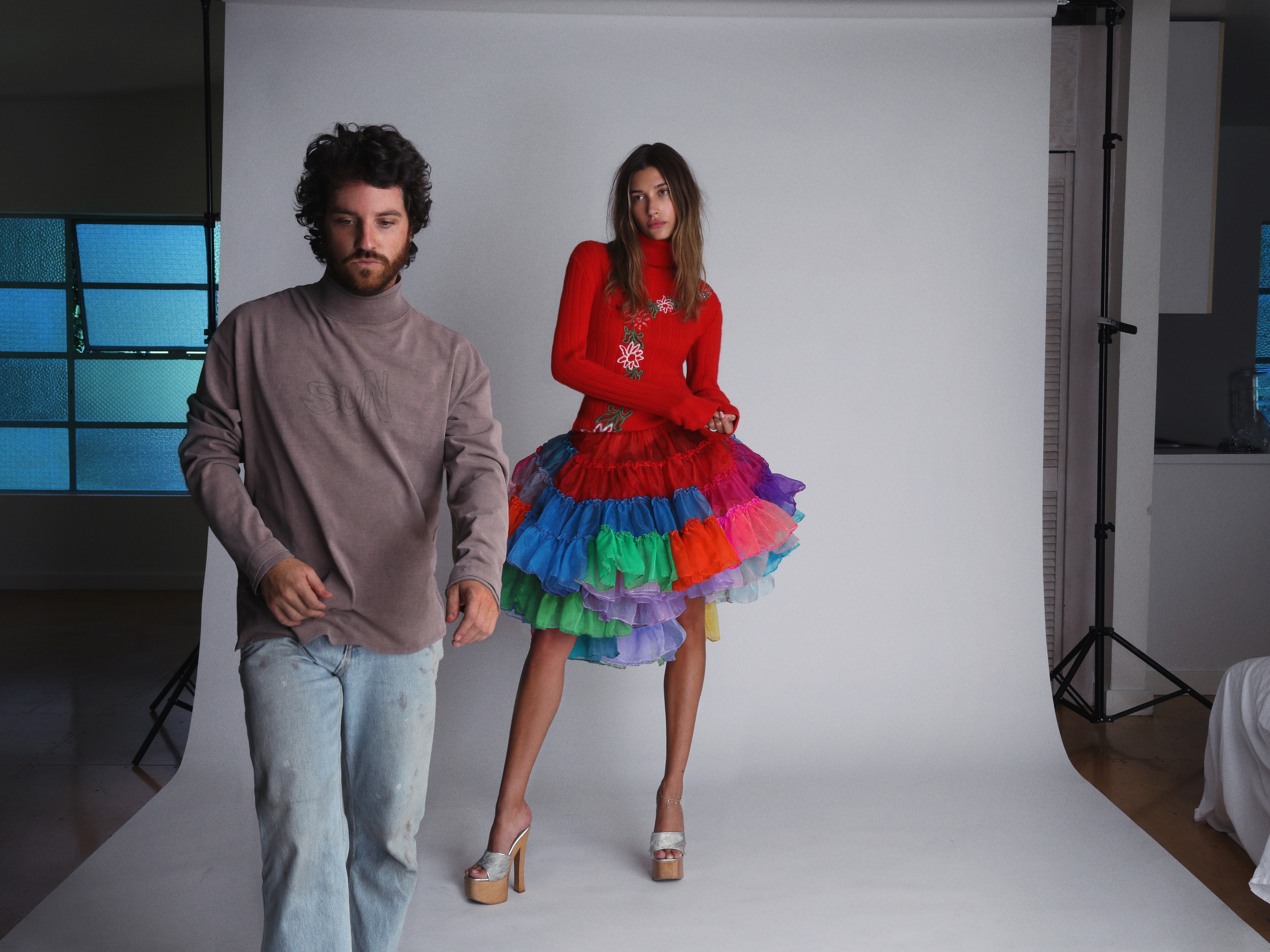 Shoot for the Stars Linnetz in his design studio photographs model Hailey Bieber who wears a sweater skirt and mules by...