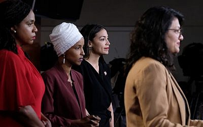 WASHINGTON, DC - JULY 15: (Left to right) US Reps. Ayanna Pressley (Democrat-Massachusetts), Ilhan Omar (Democrat-Minnesota) and Alexandria Ocasio-Cortez (Democrat-New York) listen as Rep. Rashida Tlaib (Democrat-Michigan) pauses while speaking at a news conference at the US Capitol in Washington, D.C. on July 15, 2019. (Alex Wroblewski/Getty Images/AFP)