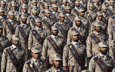 Revolutionary Guard troops attend a military parade marking the 39th anniversary of the start of the Iran-Iraq war, in front of the shrine of the late revolutionary founder Ayatollah Khomeini, just outside Tehran, Iran, on September 22, 2019. (Iranian Presidency Office via AP)