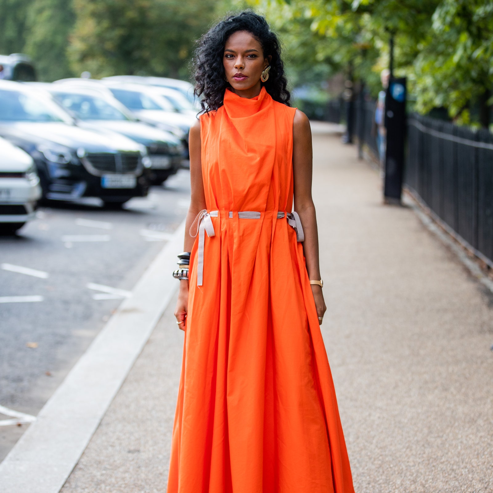 LONDON ENGLAND  SEPTEMBER 20 Guests seen wearing orange dress outside ROKSANDA during London Fashion Week September 2021...