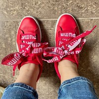 a pair of feet wearing blue and red shoes