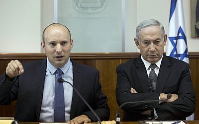 Prime Minister Benjamin Netanyahu, right, and then-Education Minister Naftali Bennett, left, attend the weekly cabinet meeting at the Prime Minister's Office in Jerusalem, Tuesday, August 30, 2016. (Abir Sultan/Pool/via AP)