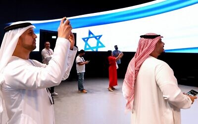 People take pictures in the Israel pavilion during a media tour ahead of the opening of the Dubai Expo 2020 in the Gulf Emirate on September 27, 2021 (AFP)