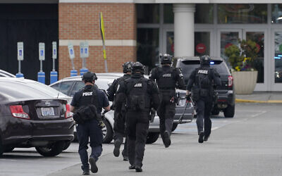 Illustrative -- Police officers jog toward an entrance at the Westfield Southcenter Mall after the shopping center was evacuated following a reported shooting, May 1, 2021, in Tukwila, Washington, south of Seattle. (AP Photo/Ted S. Warren)