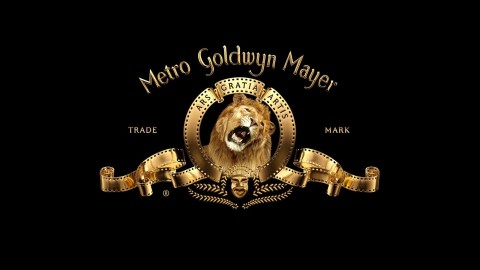 Trademarked logo for Metro Goldwyn Mayer in gold, on black background