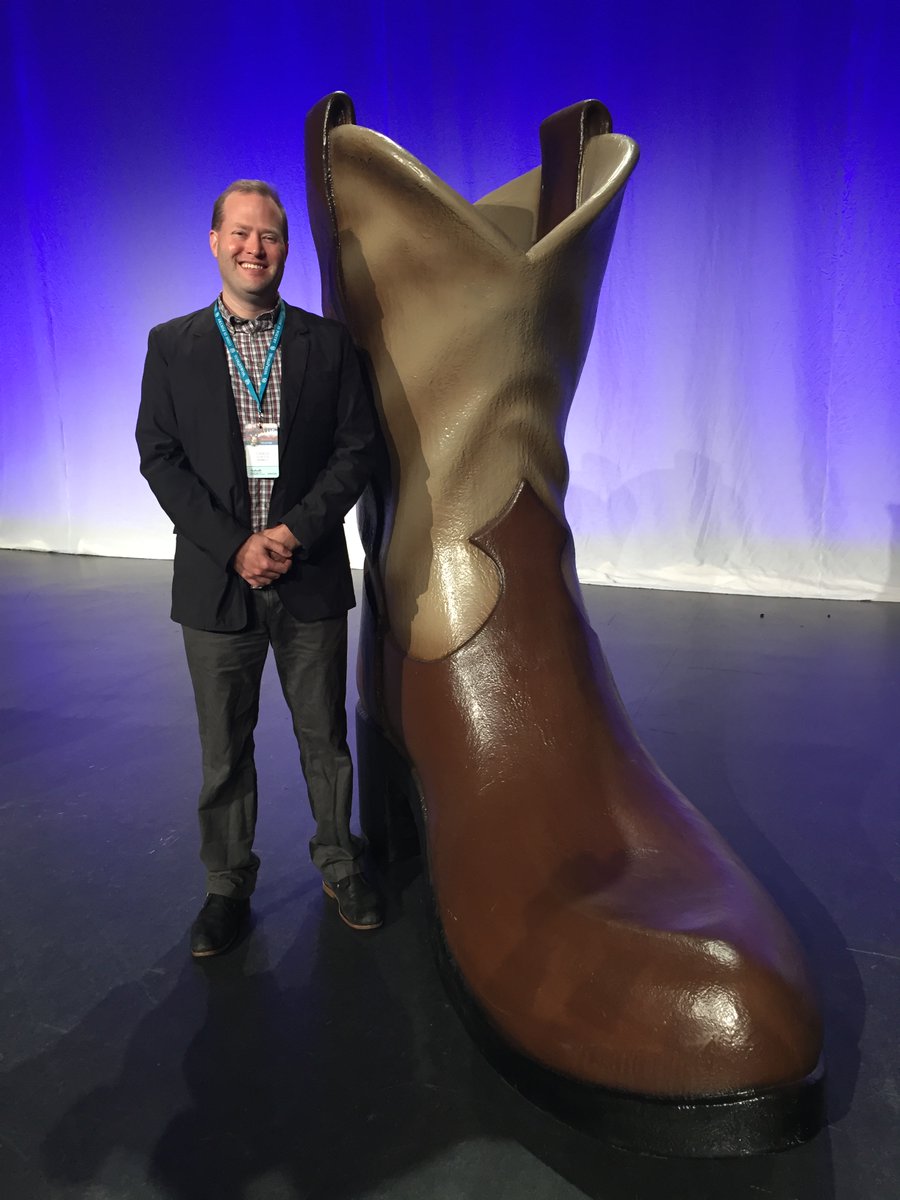 Chris standing next to the on-stage boot from WCUS 2017.