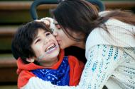 Young child with Cerebral Palsy and his sister.