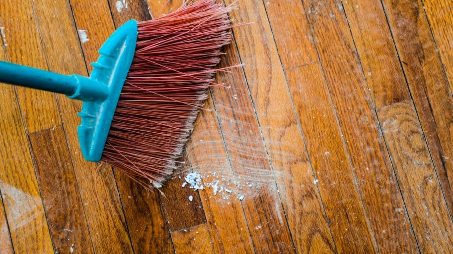 broom sweeping a floor