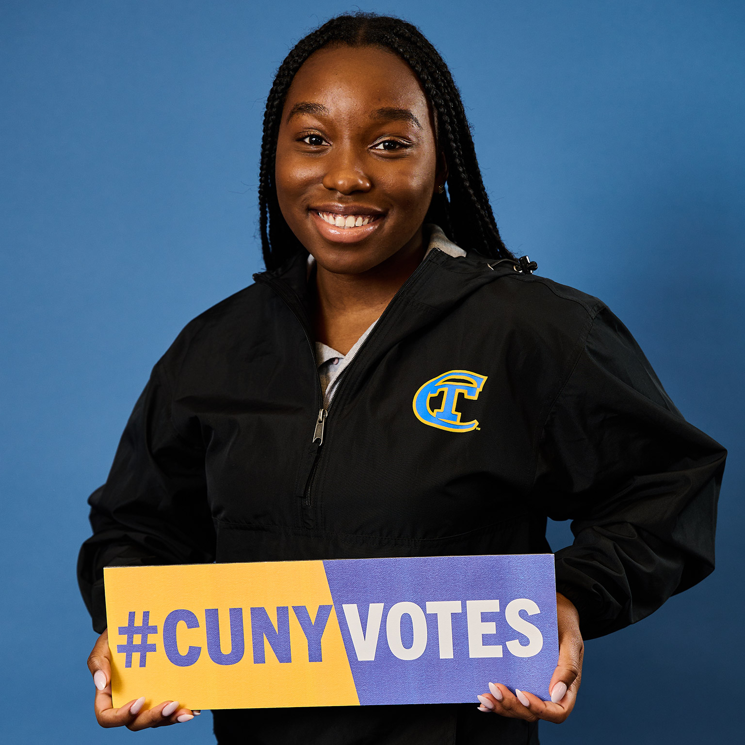 USS PRESIDENT Juvanie Piquant WITH #CUNYVOTES sign to promote voting by CUNY students