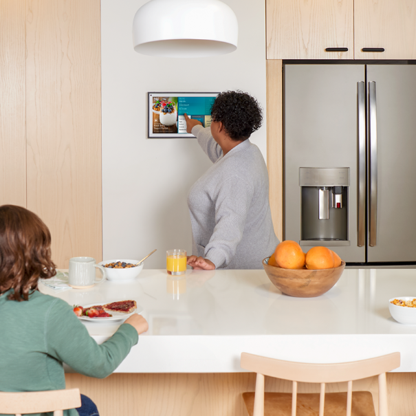 An image of a family eating breakfast in their kitchen.