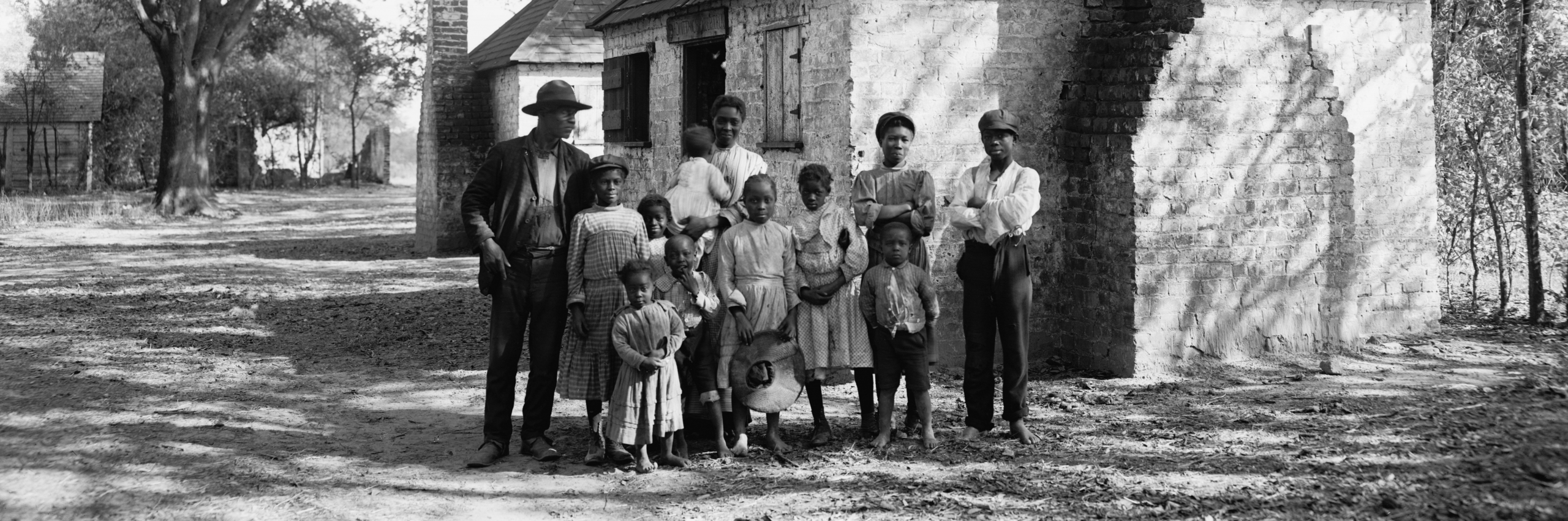 Family outside a plantation