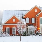 orange brick house in winter