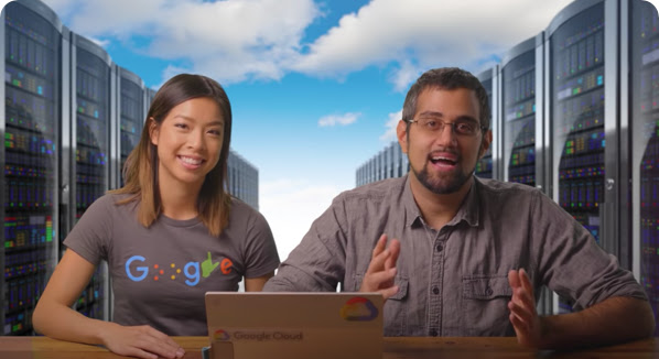 Google Developer Advocates Stephanie Wong and Mark Mirchandani sit side-by-side at desk with a laptop open in front of them