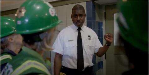 A police officer talking to cert volunteers.