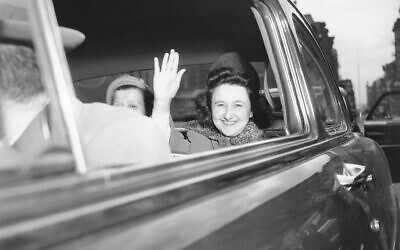 Ethel Rosenberg smiles and waves as she leaves New York's Women's detention home in an automobile for the death house in Sing Sing Prison April 11, 1951. The 35-year-old Mrs. Rosenberg and her husband, Julius, 32, were sentenced to die for furnishing wartime atom secrets to a soviet spy ring. (AP Photo/Murray Becker)