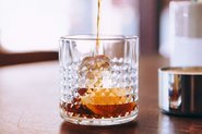 Fruit brandy being poured into a glass; Photo by StockSnap, Burst