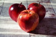 Red apples on wooden floor; Photo by Pexels, Suzy Hazelwood