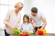 Family cooking a vegetarian meal.