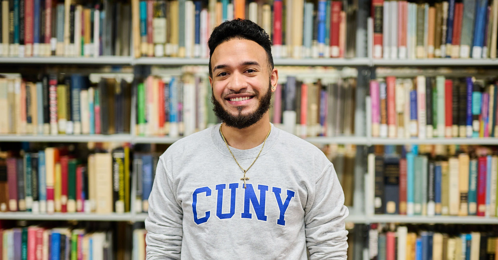 CUNY staffmember in library back to school