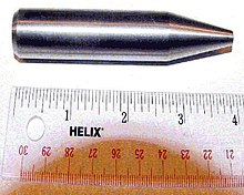 Shiny metallic cylinder with a sharpened tip. The overall length is 9 cm and diameter about 2 cm.