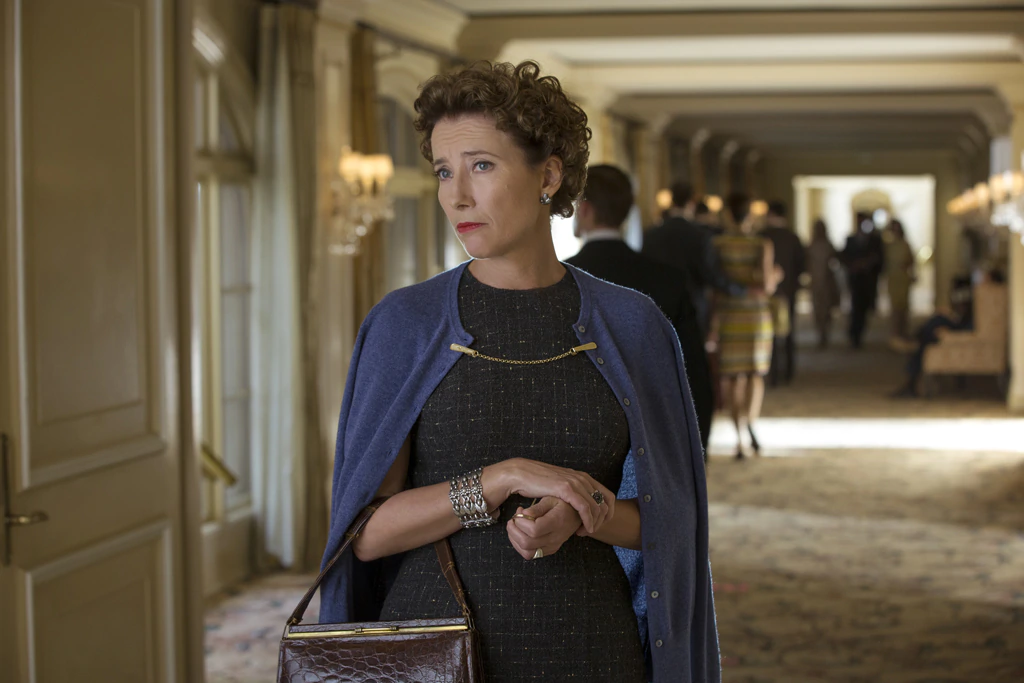 Actor Emma Thompson as P.L. Travers standing in a hallway in the movie "Saving Mr. Banks".