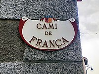 A street sign with the words CAMI DE FRANÇA.