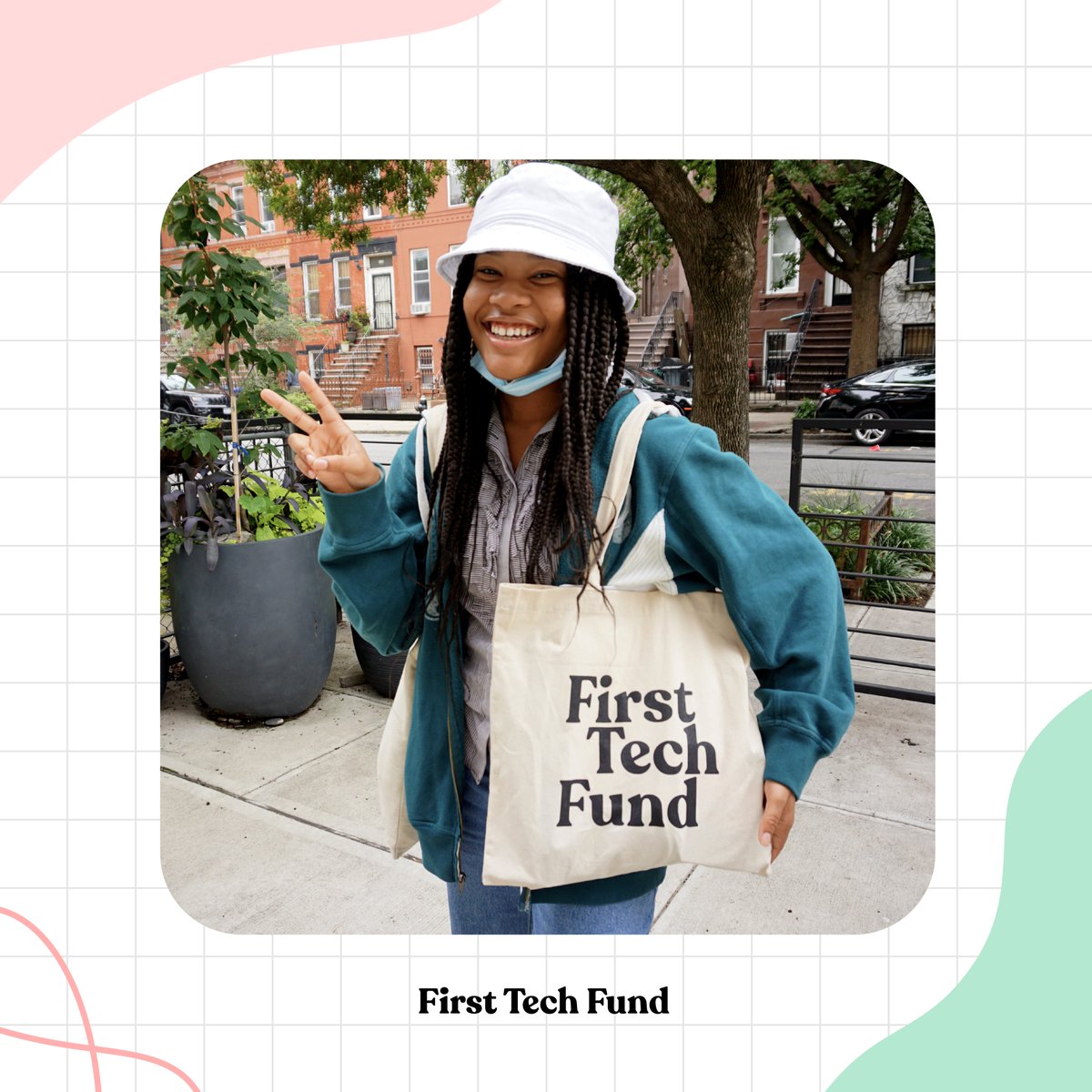 Photograph of First Tech Fund student smiling and showing their First Tech Fund tote bag.