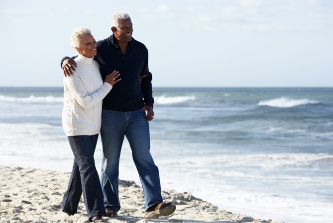 A pair of people on a beach.