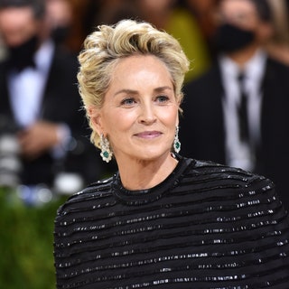 Image may contain: Sharon Stone, Human, Person, Fashion, Premiere, Home Decor, Suit, Coat, Clothing, Overcoat, and Apparel