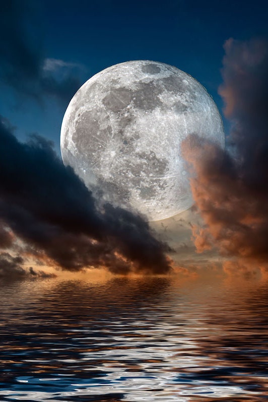 Magical evening on the sea. Big full moon reflection in water