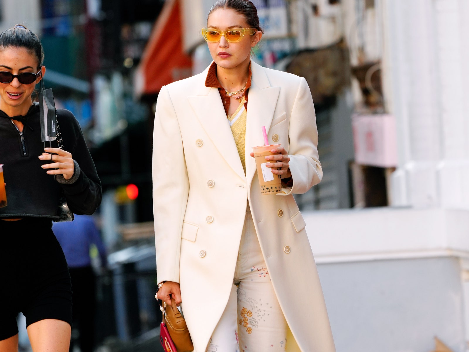 Image may contain Clothing Apparel Human Person Sunglasses Accessories Accessory Gigi Hadid Coat Suit and Overcoat