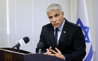 Foreign Minister Yair Lapid speaks during a faction meeting of his Yesh Atid party at the Knesset, on June 21, 2021. (Olivier Fitoussi/Flash90)