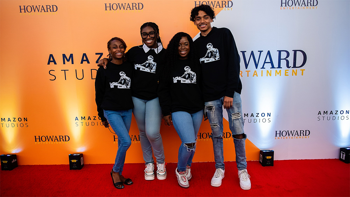 Howard Entertainment students posing on a red carpet