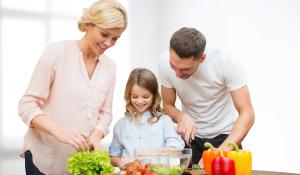 Family cooking a vegetarian meal.