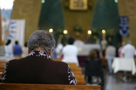 woman praying in church