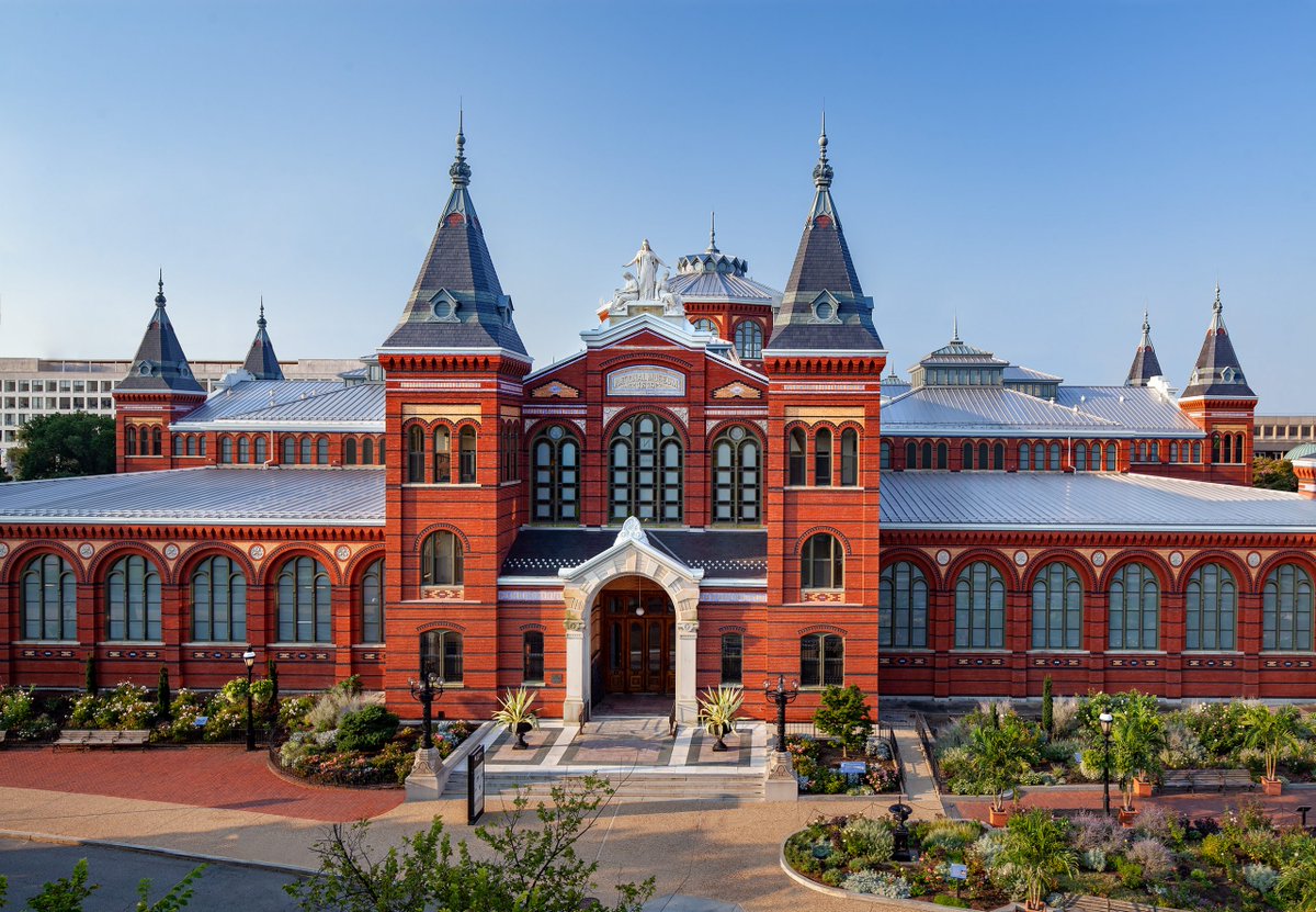 View of the Smithsonian Arts and Industries Building, an ornate red brick building.