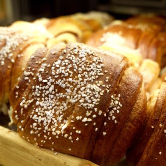 A close-up of a tray filled with cinnamon buns.