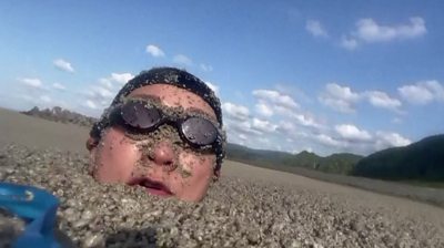 Swimming in Okinawa, Japan, under floating pumice stone