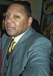 Marsalis reaching toward the camera