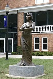 This eight foot bronze sculpture was erected on November 9, 2006 in front of Twichell Auditorium on the campus of Converse College in Spartanburg, South Carolina. Designed by New York-based artist Meredith Bergmann and commissioned by the college; the sculpture is housed permanently on the campus.