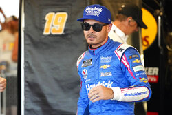 Kyle Larson walks after winning the pole for the NASCAR Cup Series auto race Saturday, Nov. 6, 2021, in Avondale, Ariz. (AP Photo/Rick Scuteri)