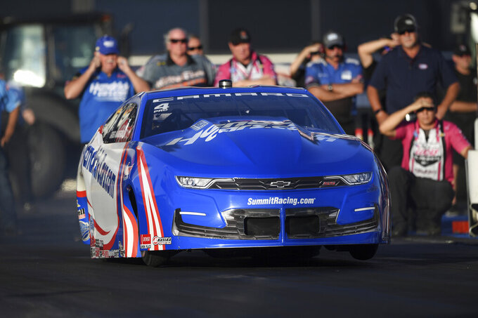 In this photo provided by the NHRA, Greg Anderson drives in Pro Stock qualifying Friday, Nov. 12, 2021, at the Auto Club NHRA Finals drag races at Auto Club Raceway in Pomona, Calif. (Marc Gewertz/NHRA via AP)