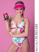 Chelyabinsk/Russia - April 12, 2019; Sexy woman in a swimsuit holding a Pepsi jar. Редакционное фото, фотограф Женя Канашкин / Фотобанк Лори