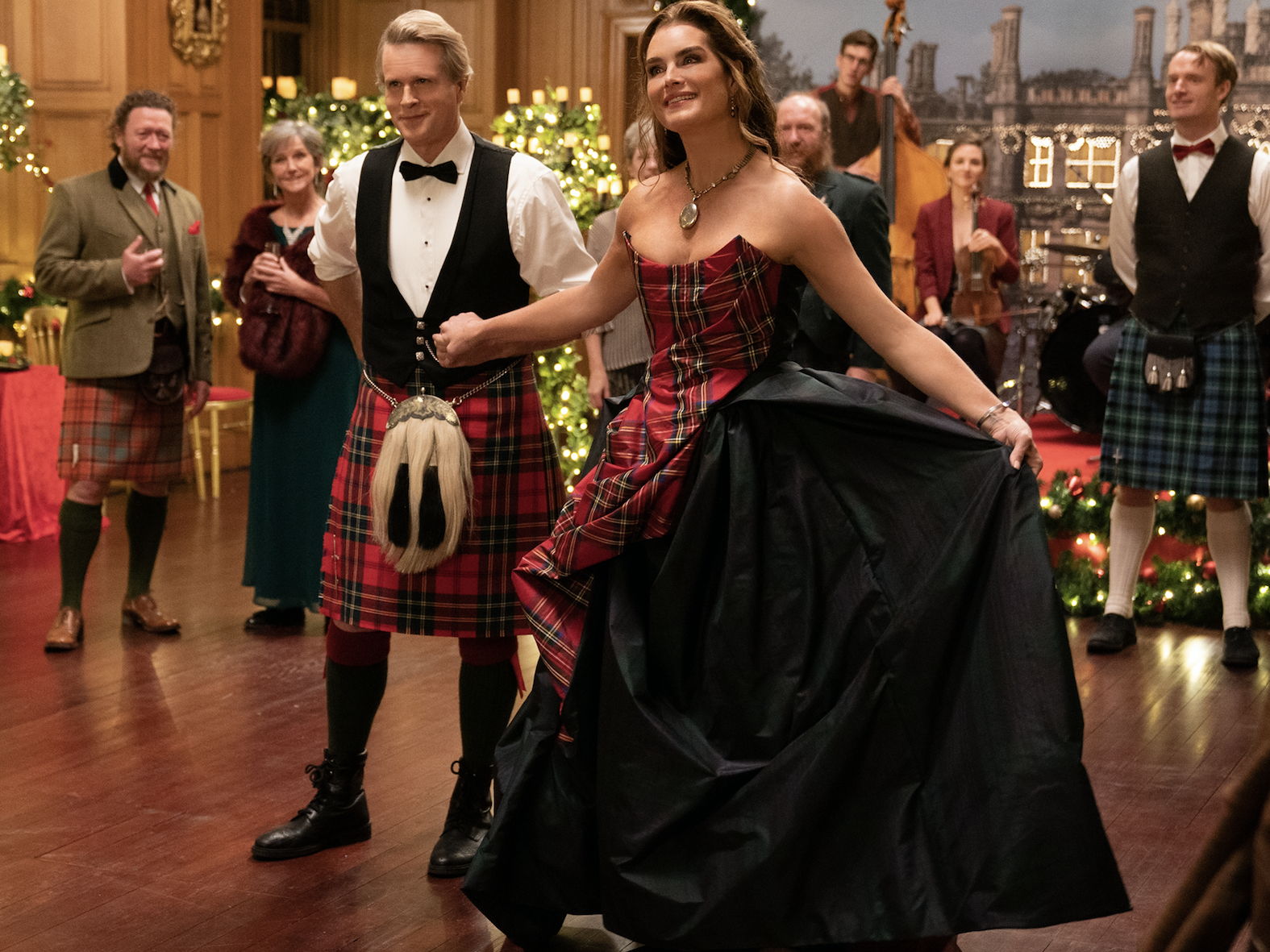 Image may contain Clothing Apparel Cary Elwes Human Person Skirt Footwear Shoe Plaid Tartan and Kilt