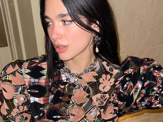 Image may contain Face Human Person Skin Dua Lipa and Hair